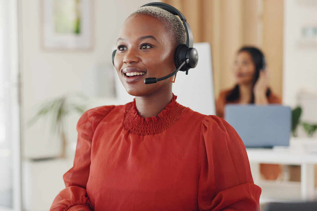 a woman wearing a wireless headset.